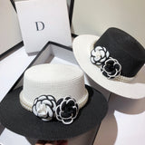 Design light light luxury small fragrance flat top hat women summer straw woven wild black and white flower wind sun hat